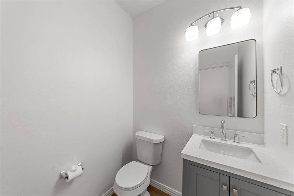 7916 Hannah Street, Plano, TX 75025 Bathroom featuring a modern vanity with gray cabinetry, a light-toned countertop, and a rectangular undermount sink