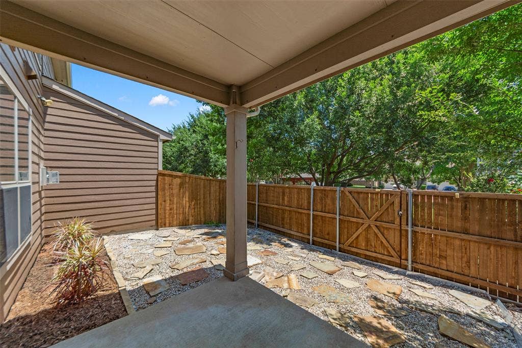 7916 Hannah Street, Plano, TX 75025 Covered patio featuring a concrete slab and stone paver accents