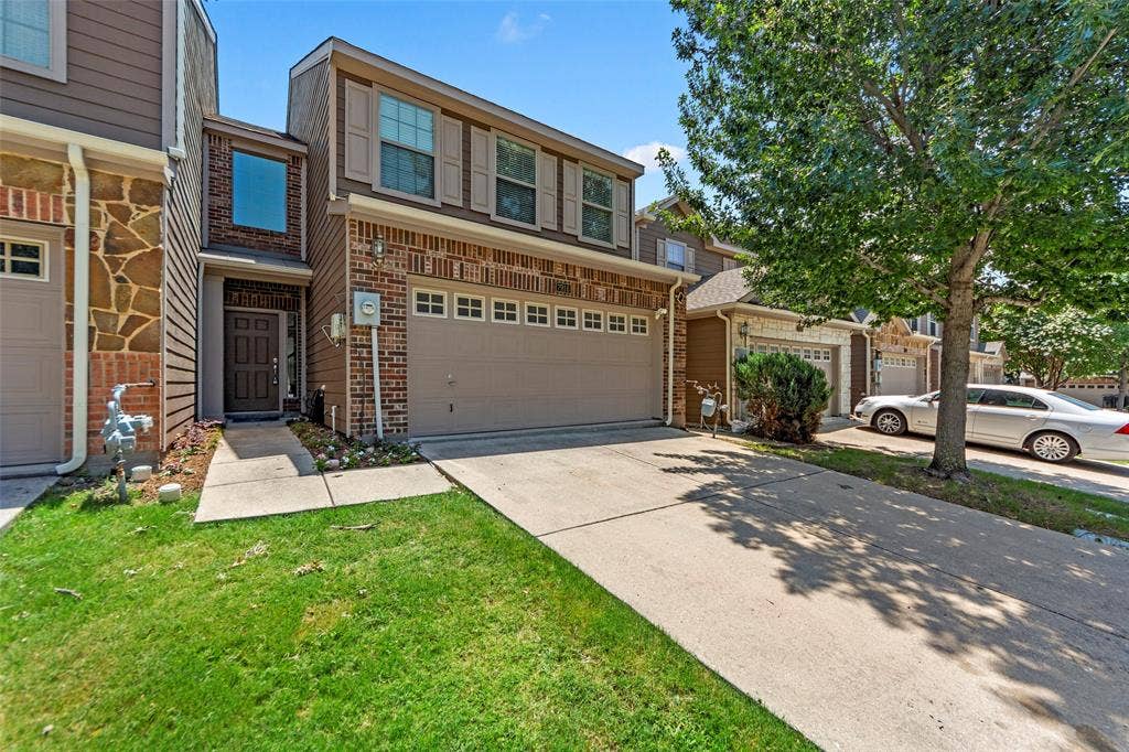 7916 Hannah Street, Plano, TX 75025 Two-story residence featuring a brick and siding facade with stone accents
