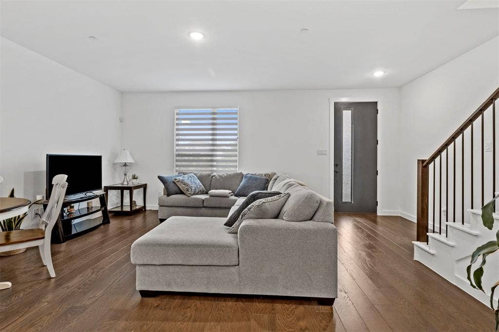 616 Collier Drive, Plano, TX 75075 Open concept living space featuring wide wood flooring