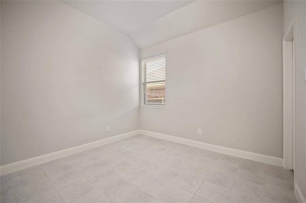 231 Carson Drive, Waxahachie, TX 75167 Secondary bedroom with large walk-in closet located at the center of the home, right next to the secondary bathroom. This room is completely separate from the other 2 bedrooms.