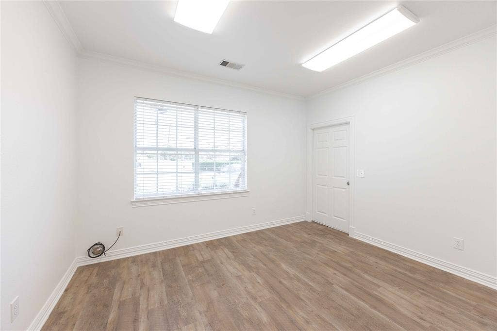 2840 Keller Springs Road, #1201, Carrollton, TX 75006 Wood-finish flooring, crown molding, white trim, recessed lighting, and a window with blinds