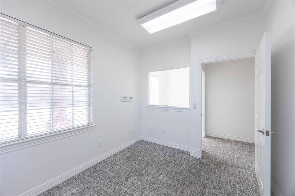 2840 Keller Springs Road, #1201, Carrollton, TX 75006 White walls, patterned carpet flooring, transom window, recessed lighting, and crown molding
