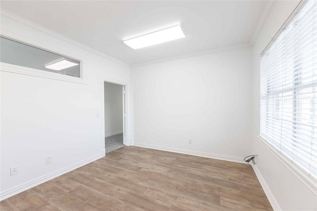 2840 Keller Springs Road, #1201, Carrollton, TX 75006 Wood-finish flooring with white baseboards