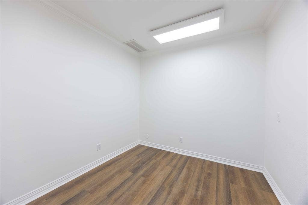 2840 Keller Springs Road, #1201, Carrollton, TX 75006 Recessed rectangular ceiling light, wood-finish flooring, white walls, white trim, and crown molding