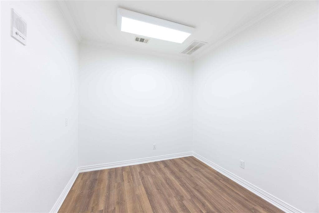 2840 Keller Springs Road, #1201, Carrollton, TX 75006 Recessed lighting, crown molding, wood-finish flooring, white walls, and white trim