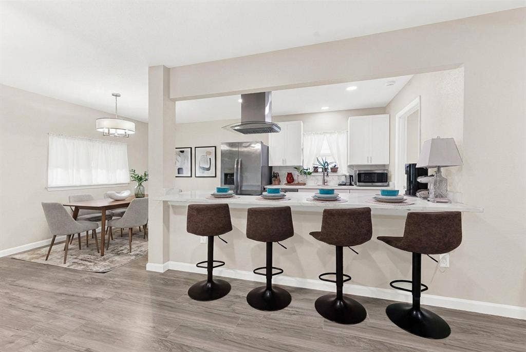 745 Pinehurst Drive, Richardson, TX 75080 Oversized breakfast bar -virtually staged