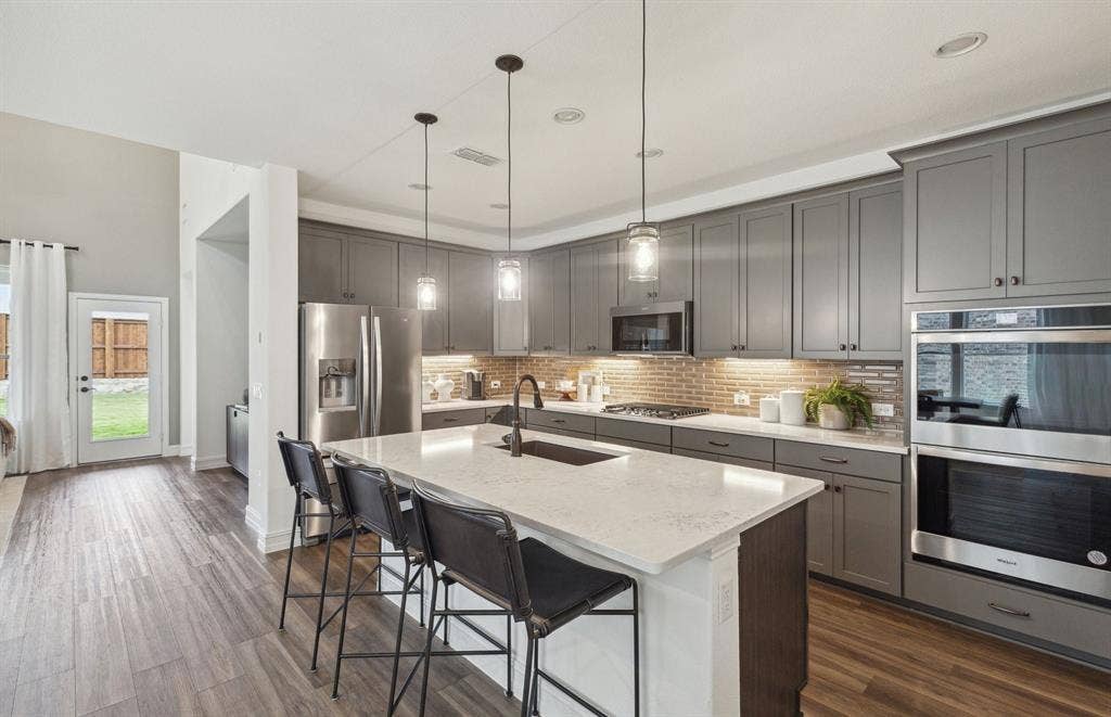 1809 Briarcrest Drive, Celina, TX 75009 *Model Representation - Spacious kitchen with eat-in bartop island