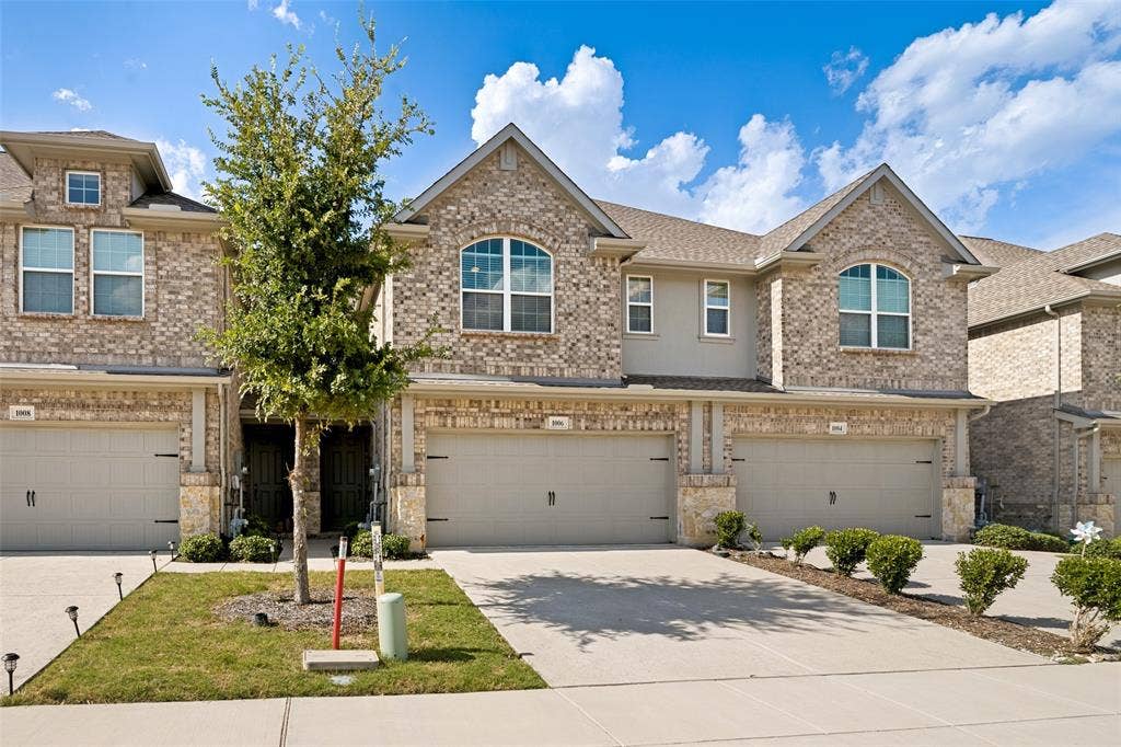 1006 Emil Place, Allen, TX 75013 Brick and stone facade townhome with arched window accents