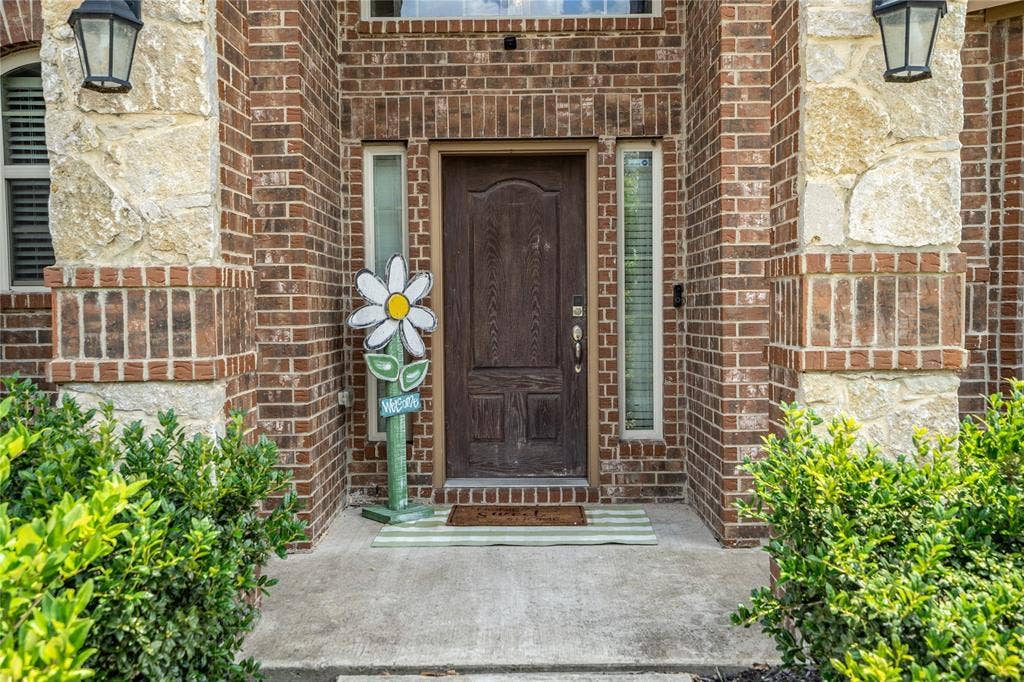 2101 Trinity Lane, Wylie, TX 75098 Brick and stone exterior.
