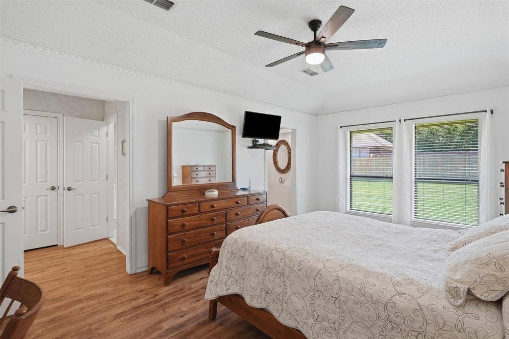 5711 Cortez Drive, Granbury, TX 76049 His and her bathrooms and their own closet.