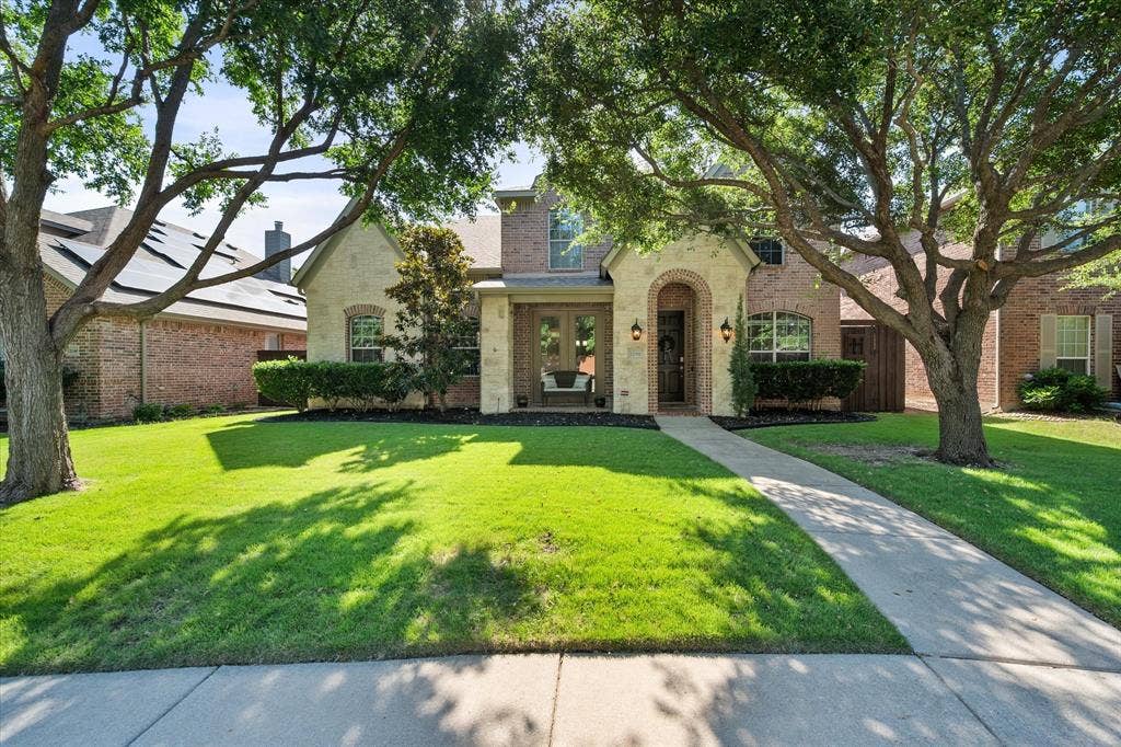 12032 Terrazzo Lane, Frisco, TX 75035 Trees accent the front of this beautiful home!