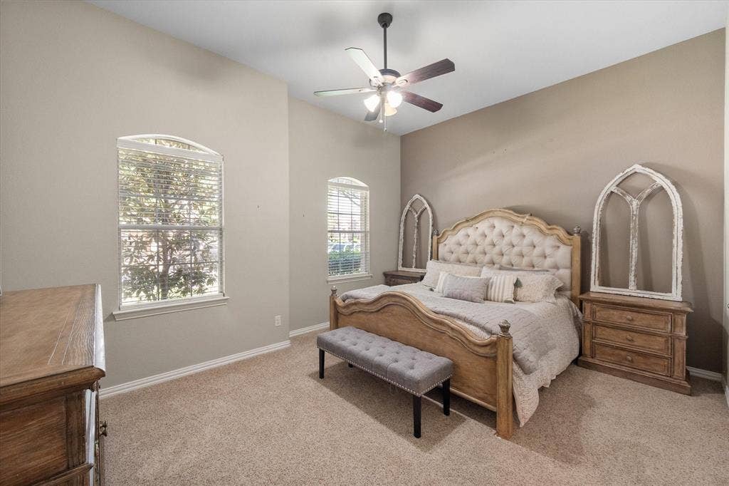12032 Terrazzo Lane, Frisco, TX 75035 Private primary suite featuring ceiling fans and arched windows!