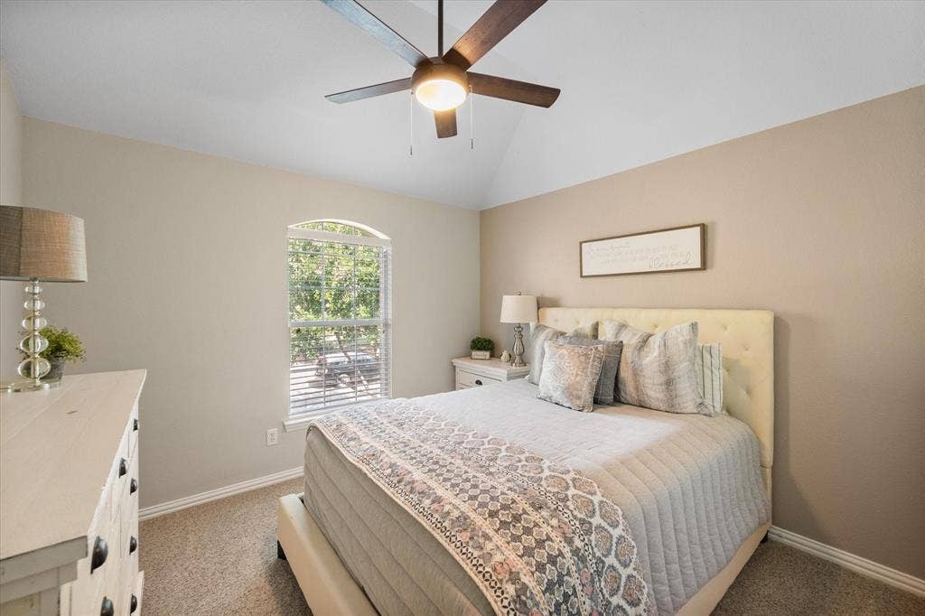 12032 Terrazzo Lane, Frisco, TX 75035 Bedroom with a wood-finish ceiling fan and integrated lighting!