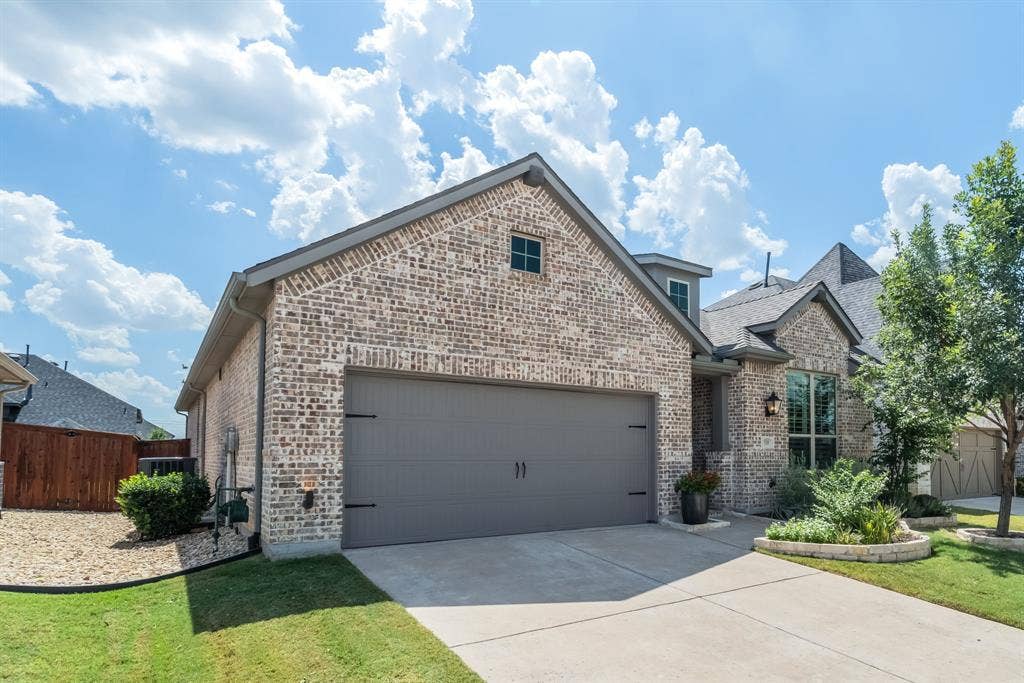 Brick exterior facade with a two-car garage