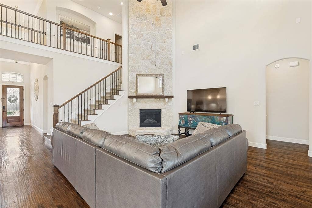 6409 Biltmore Lane, McKinney, TX 75071 Floor to ceiling Fireplace anchors the Living space