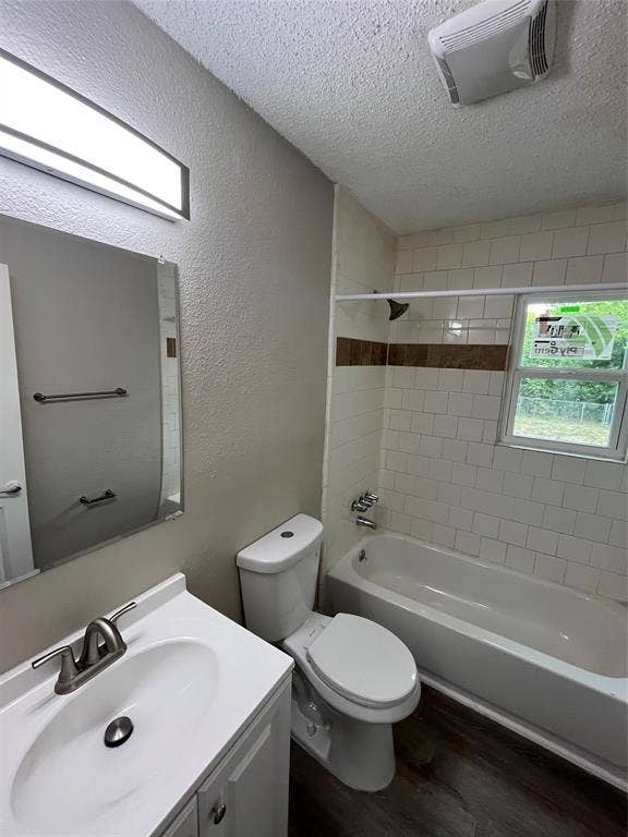 719 Fairwood Drive, Dallas, TX 75232 Bathroom featuring a white vanity with integrated sink, brushed nickel faucet, and a large wall mirror