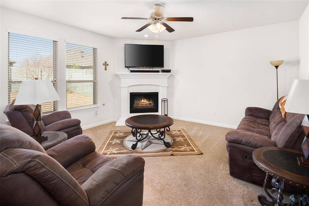The photos were taken while the home was occupied. The furniture shown in the photos is for staging purposes only and is not included with the sale of the home.