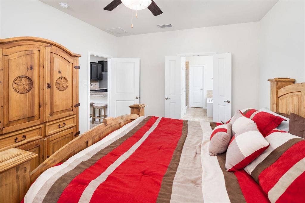 The photos were taken while the home was occupied. The furniture shown in the photos is for staging purposes only and is not included with the sale of the home.