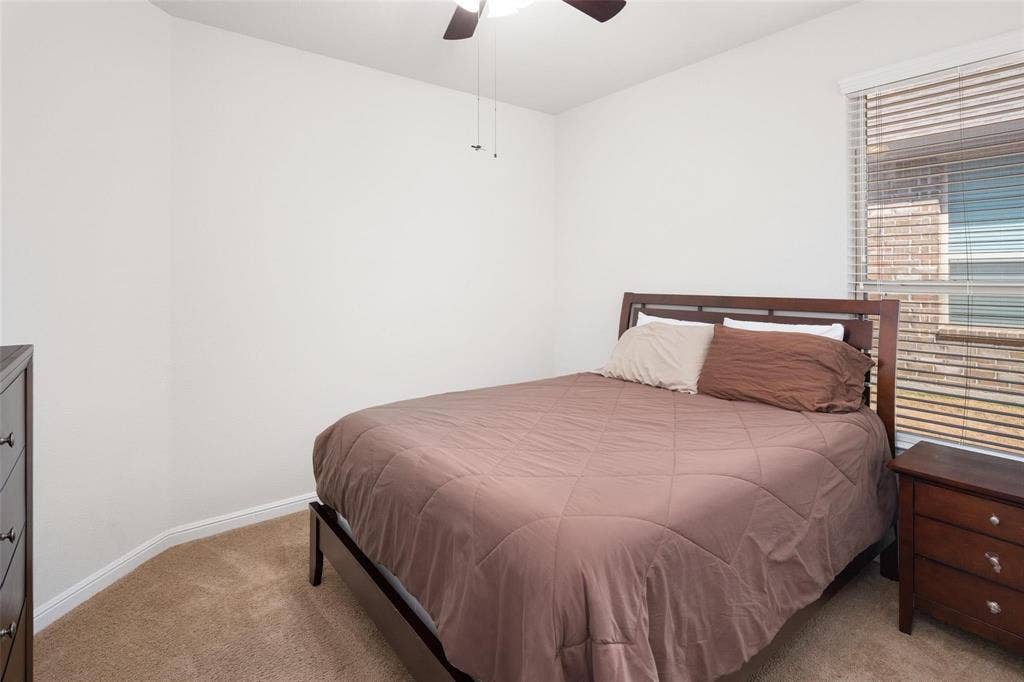 The photos were taken while the home was occupied. The furniture shown in the photos is for staging purposes only and is not included with the sale of the home.
