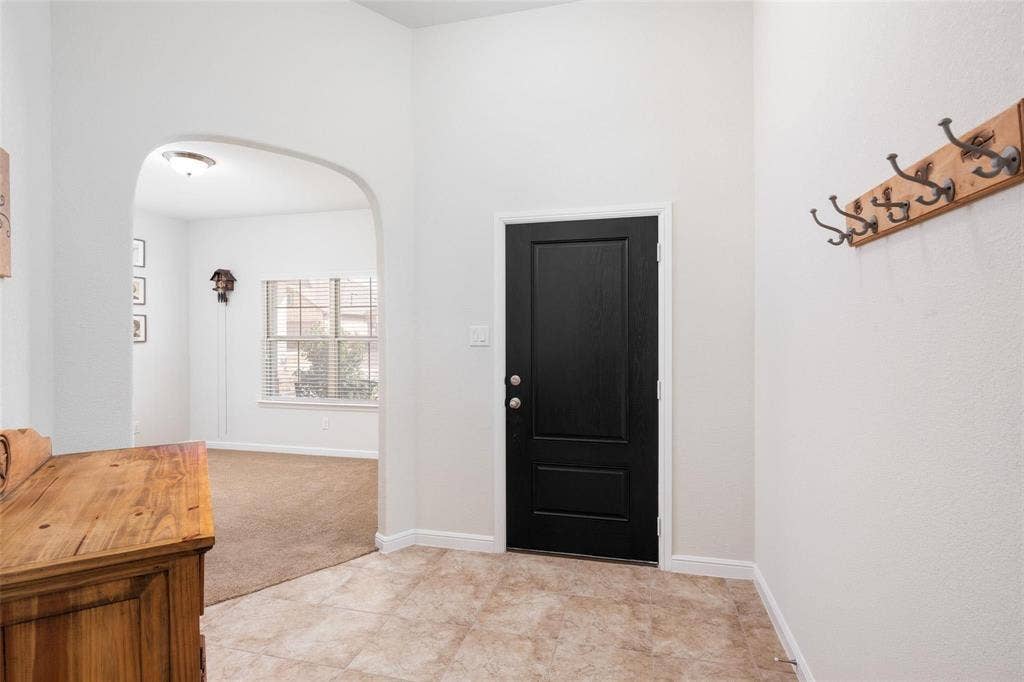 The photos were taken while the home was occupied. The furniture shown in the photos is for staging purposes only and is not included with the sale of the home.