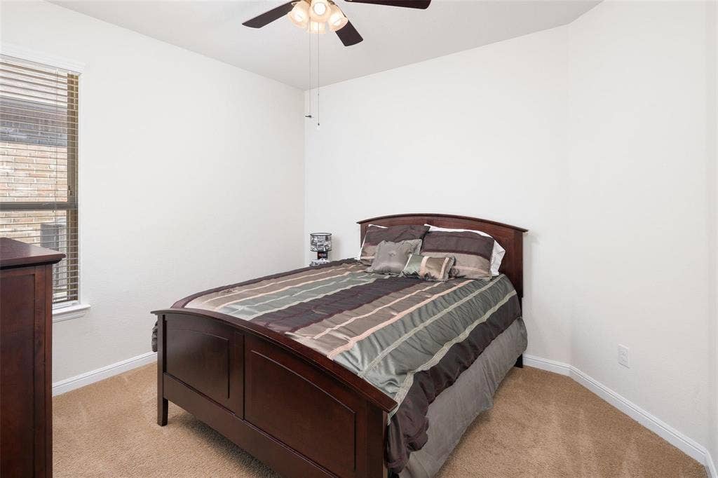 The photos were taken while the home was occupied. The furniture shown in the photos is for staging purposes only and is not included with the sale of the home.
