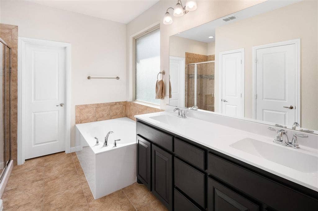 The photos were taken while the home was occupied. The furniture shown in the photos is for staging purposes only and is not included with the sale of the home.