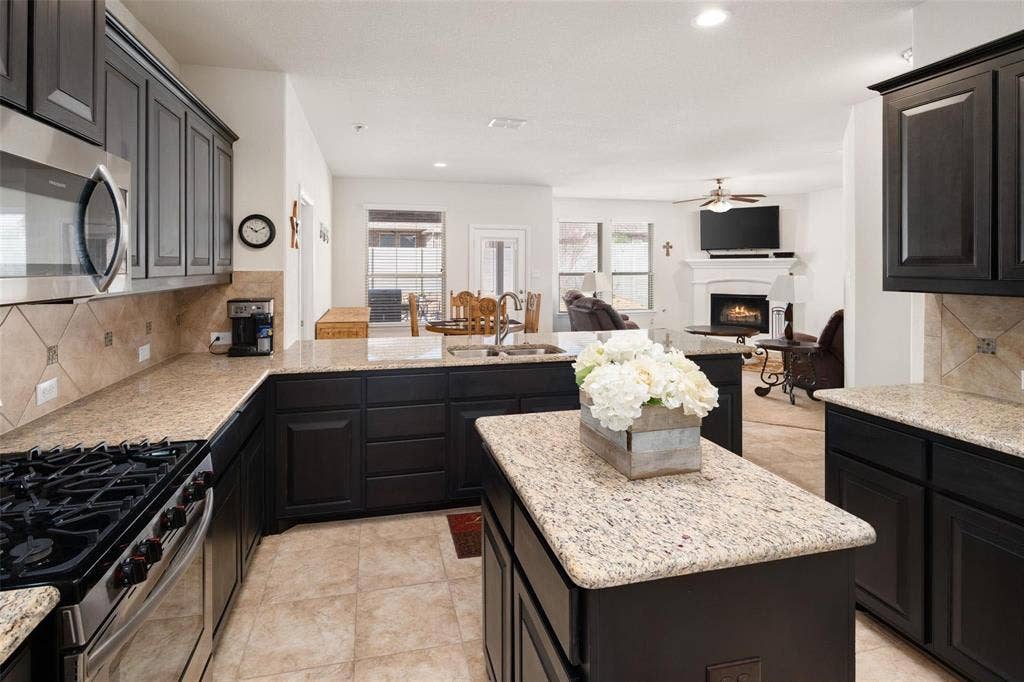 The photos were taken while the home was occupied. The furniture shown in the photos is for staging purposes only and is not included with the sale of the home.