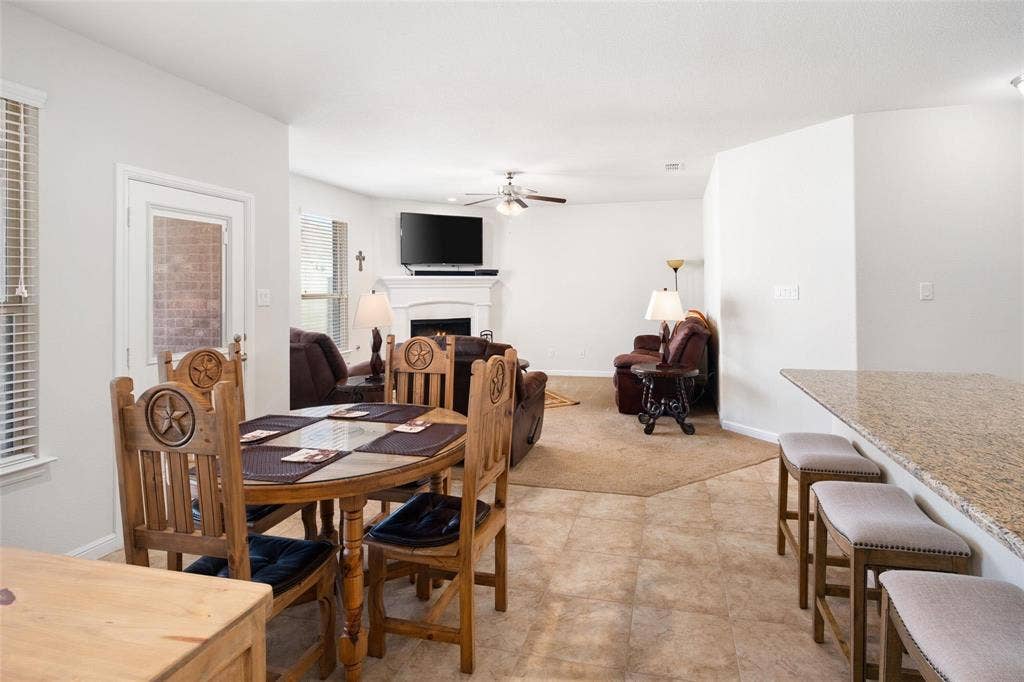 The photos were taken while the home was occupied. The furniture shown in the photos is for staging purposes only and is not included with the sale of the home.