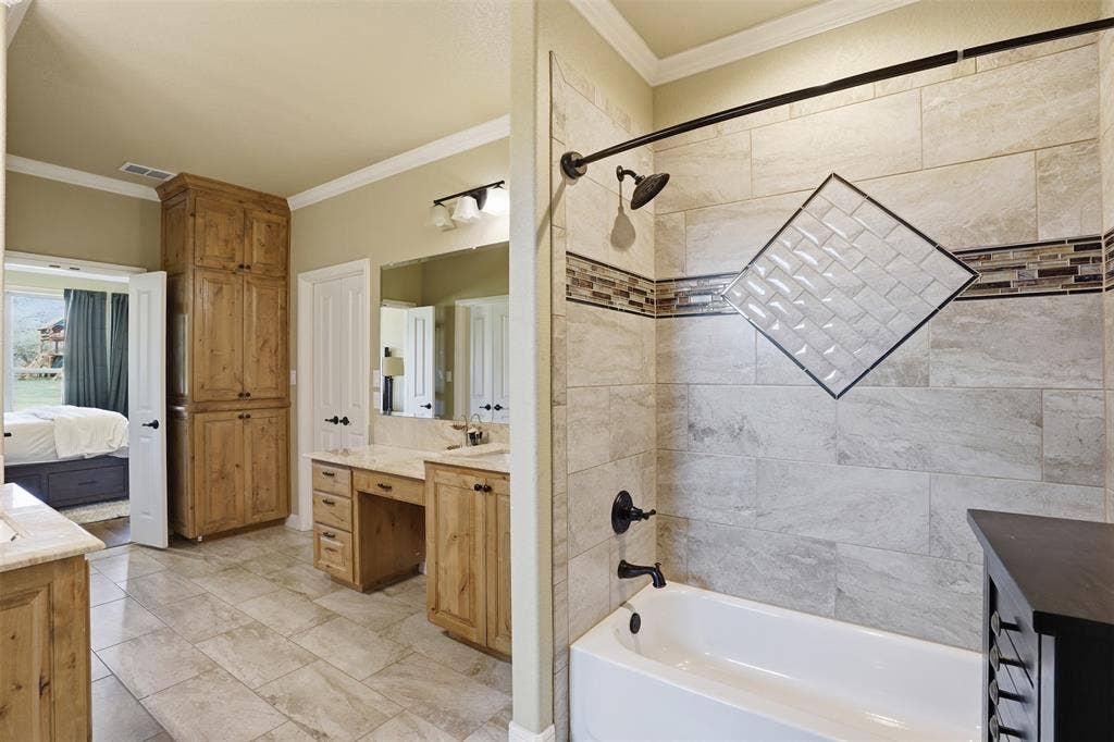 3832 Legend Trail, Granbury, TX 76049 Primary bath conveniently connects to laundry.