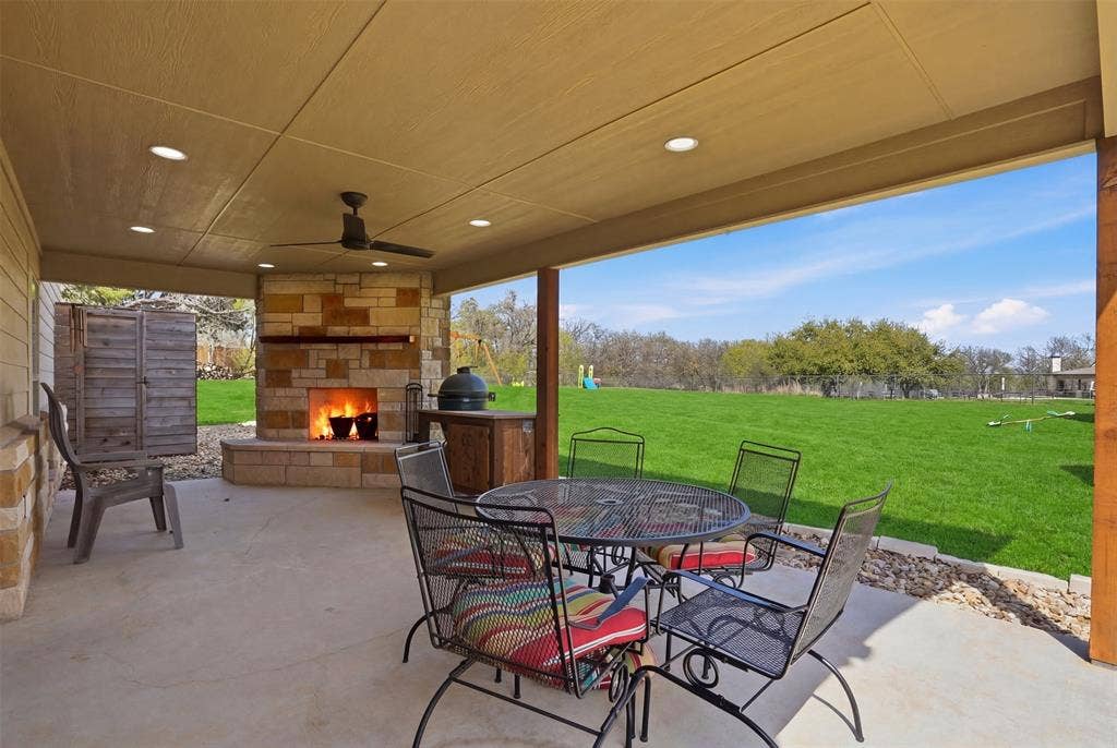 3832 Legend Trail, Granbury, TX 76049 Fireplace, seating area and even an outdoor shower.