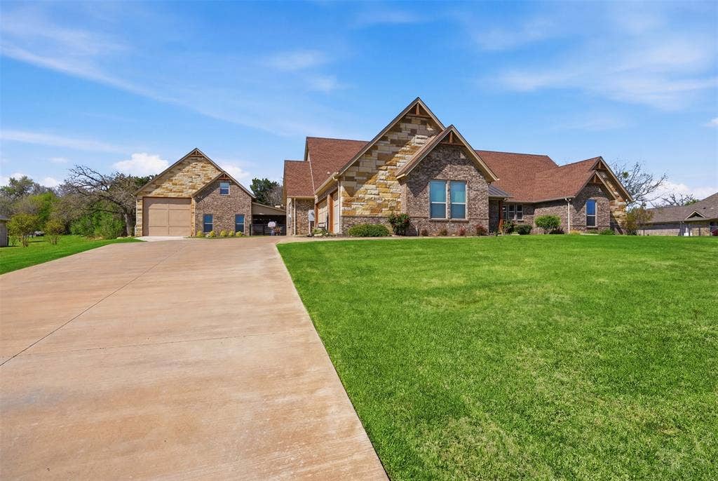 3832 Legend Trail, Granbury, TX 76049 Huge driveway to both structures. Easy access to RV storage
