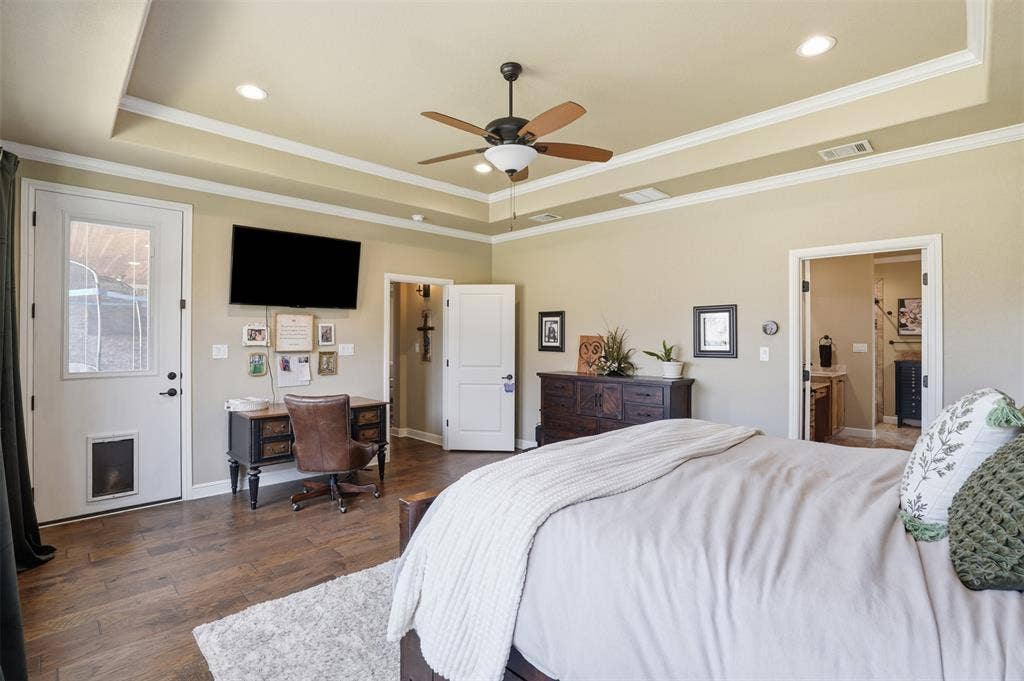 3832 Legend Trail, Granbury, TX 76049 bedroom is open and airy with access to back porch.