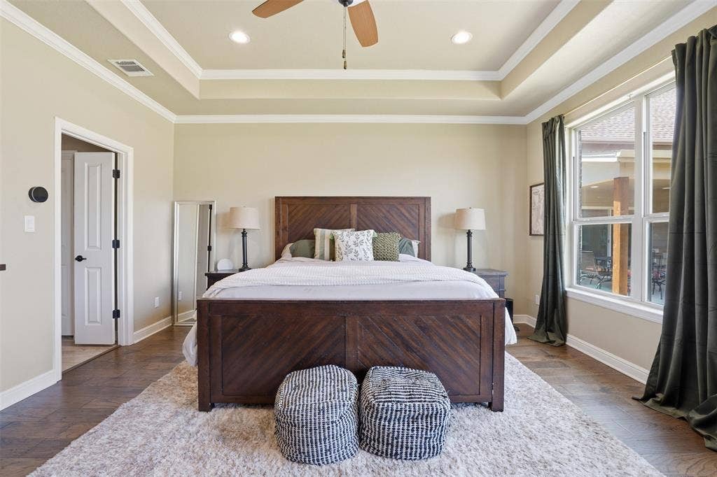 3832 Legend Trail, Granbury, TX 76049 primary bedroom has great natural light and wonderful view of backyard.