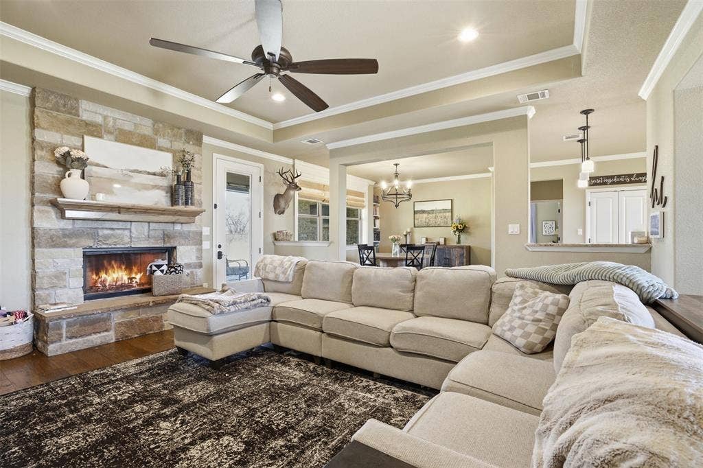 3832 Legend Trail, Granbury, TX 76049 Wood burning fireplace in living room adds to the charm.