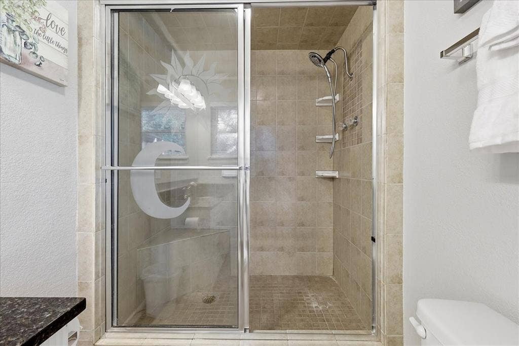 3533 Granada Drive, Richland Hills, TX 76118 updated large shower with a hand held shower head feature.