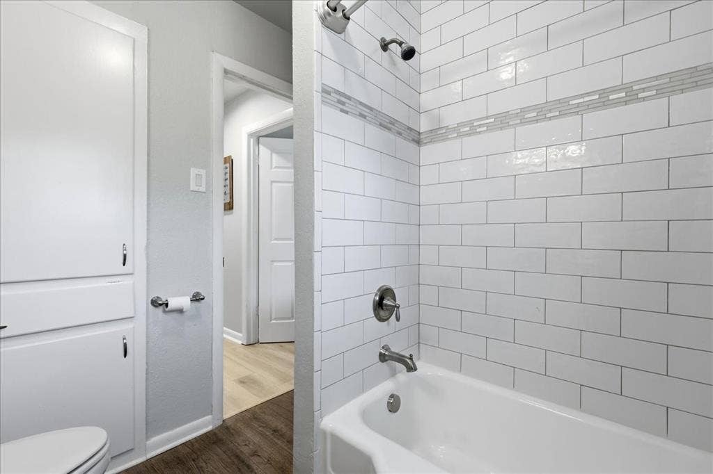 3533 Granada Drive, Richland Hills, TX 76118 shower/tub combo and a built in linen closet