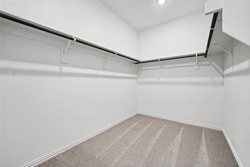 10004 Birchpoint Drive, Fort Worth, TX 76108 Built-in closet shelving and hanging rods, recessed ceiling lighting, and carpet flooring