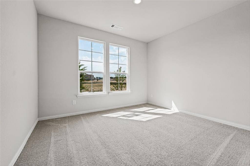 10004 Birchpoint Drive, Fort Worth, TX 76108 Neutral wall paint, dual windows, recessed ceiling lighting, and gray carpet flooring