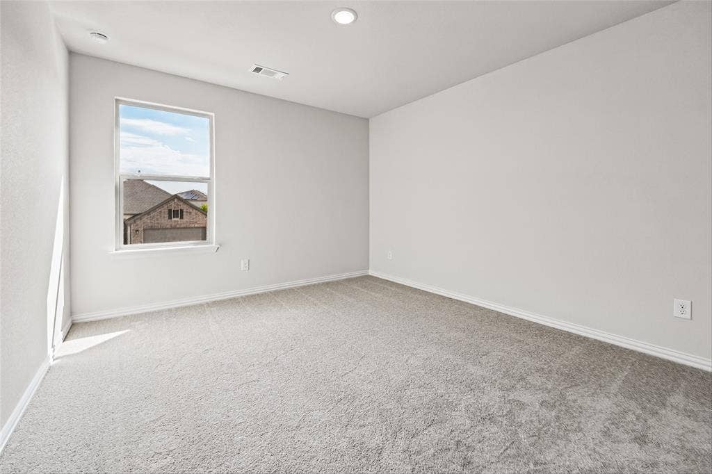 10000 Birchpoint Drive, Fort Worth, TX 76108 Neutral-toned carpeting, single pane window, recessed ceiling lighting, and white trim