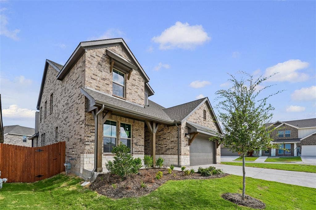 10000 Birchpoint Drive, Fort Worth, TX 76108 Brick and stone exterior with a gabled roof