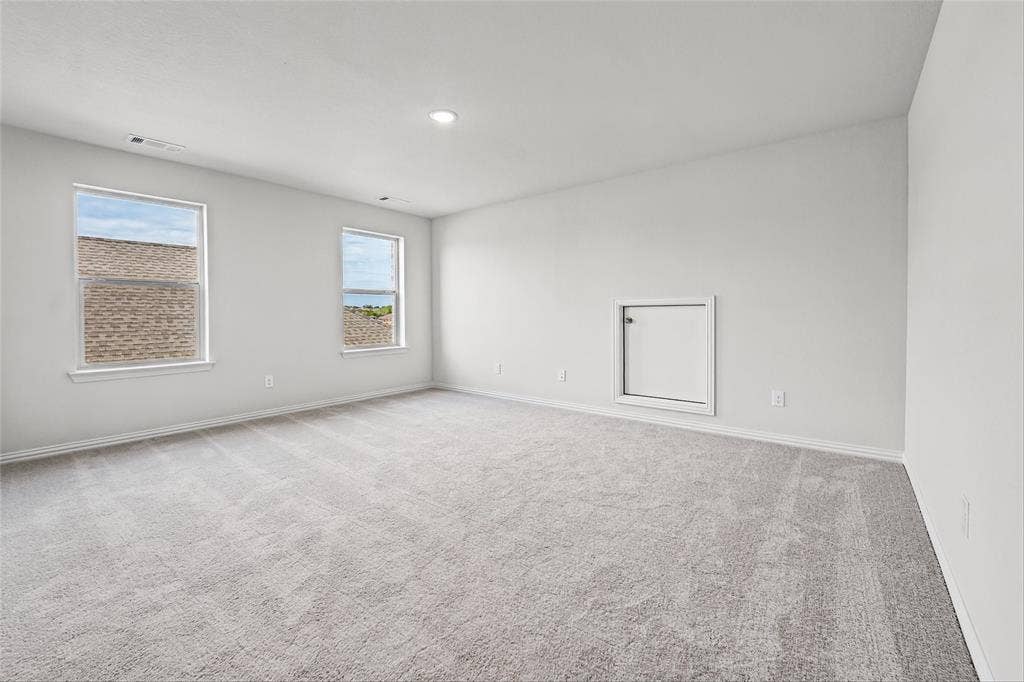 10000 Birchpoint Drive, Fort Worth, TX 76108 Spacious room with light-toned carpeting, dual windows, recessed lighting, and a white wall access panel