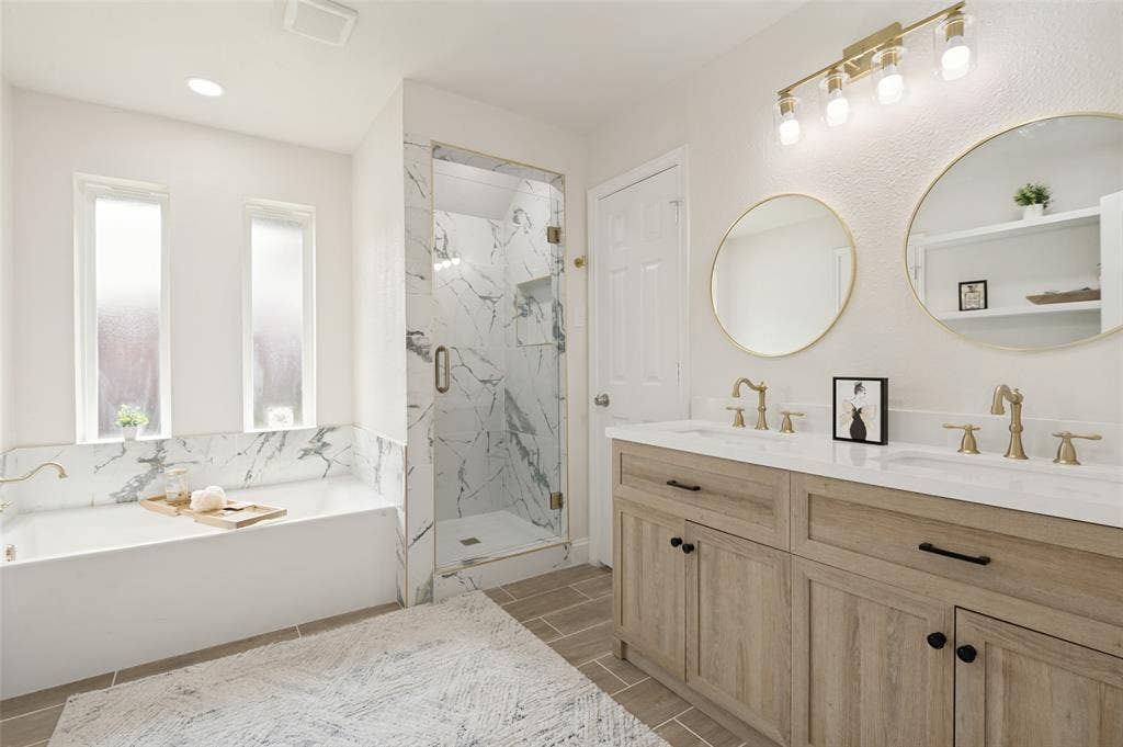 2101 Lyon Court, Plano, TX 75093 Remodeled Primary bathroom with garden tub and shower.