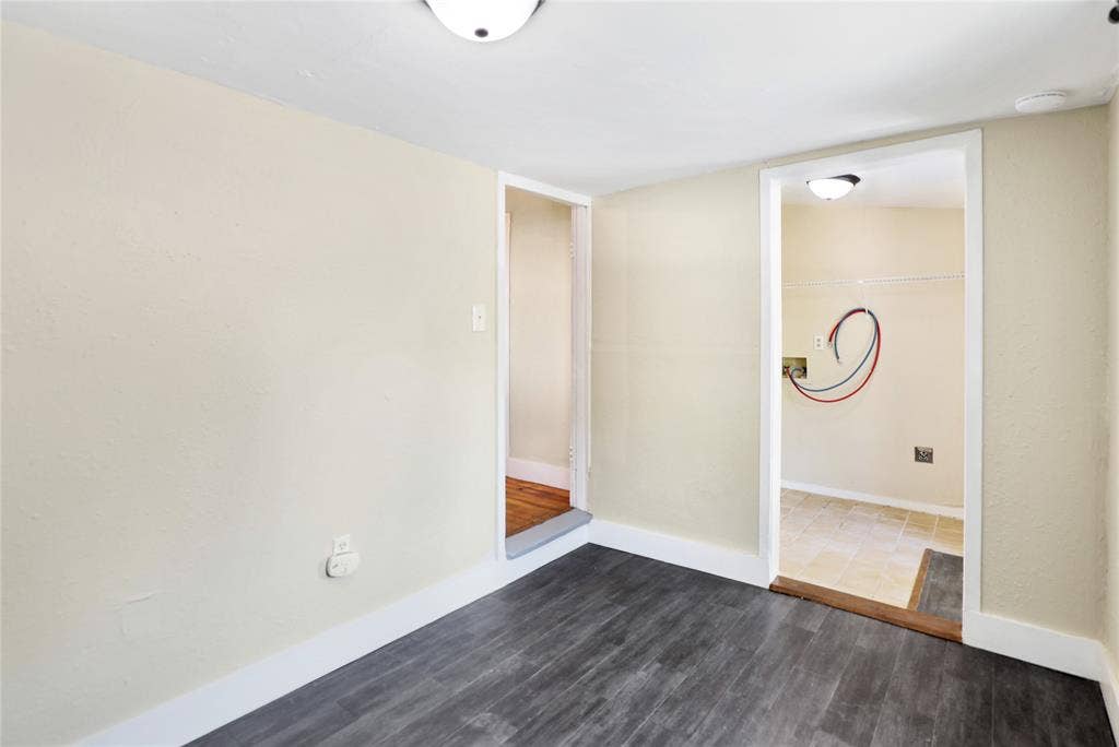 1201 1/2 Cole Street, McKinney, TX 75069 Room featuring wood-finish flooring, light-colored walls, and white trim