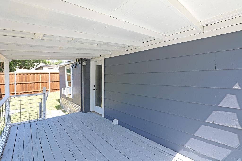 1201 1/2 Cole Street, McKinney, TX 75069 Covered rear deck featuring painted wood flooring and ceiling