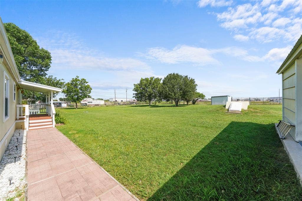 542 Private Road 4906, Haslet, TX 76052 Backyard covered porch, storm shelter and storage