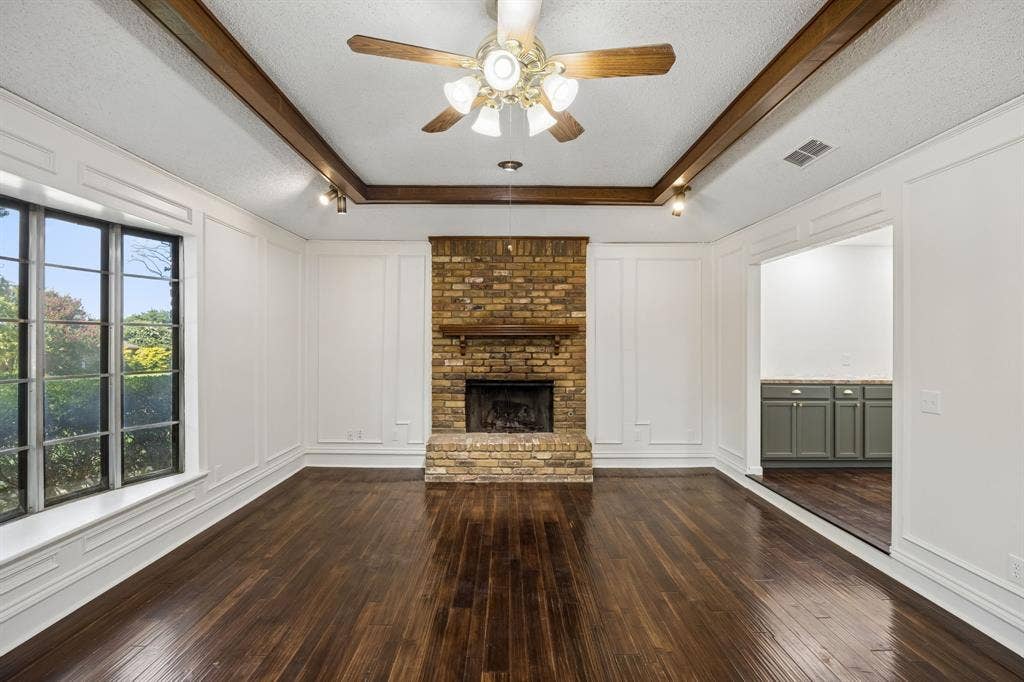 3624 Churchill Lane, Plano, TX 75075 The spacious family room offers a dramatic fireplace focal point and a flexible layout ready to reflect the next owner’s style.