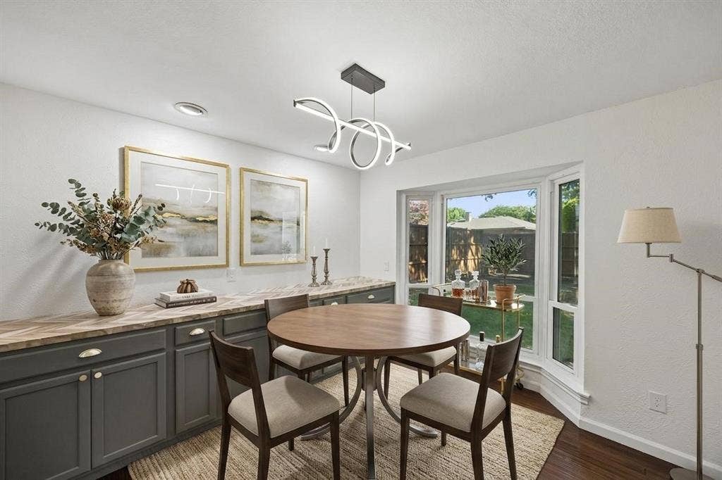 3624 Churchill Lane, Plano, TX 75075 The dining area is enhanced by a custom built-in buffet offering attractive storage for serving pieces, linens and entertaining essentials.Virtually Staged -- original image may have been altered by AI.