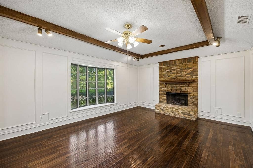 3624 Churchill Lane, Plano, TX 75075 Vaulted ceilings and substantial wood beams add dimension and timeless architectural interest to the family room.