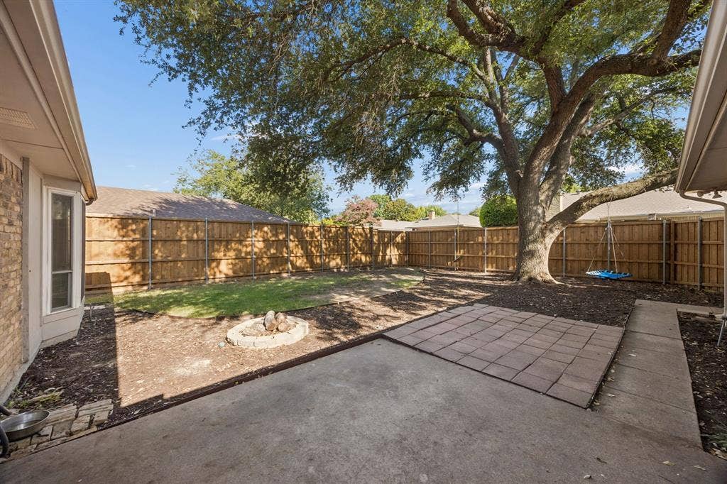 3624 Churchill Lane, Plano, TX 75075 A designated firepit area, extended flatwork and board-on-board privacy fencing provide a versatile setting for outdoor enjoyment.
